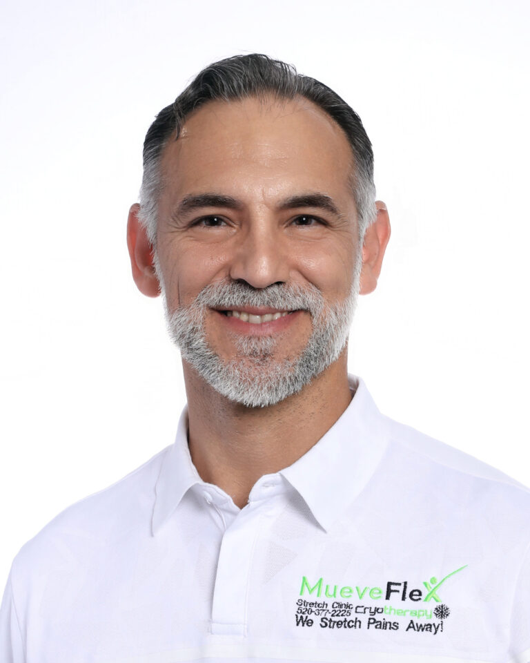 Dr. Jesus G. Bernal, founder of MueveFlex Wellness Center in Tucson, wearing a white branded polo shirt.